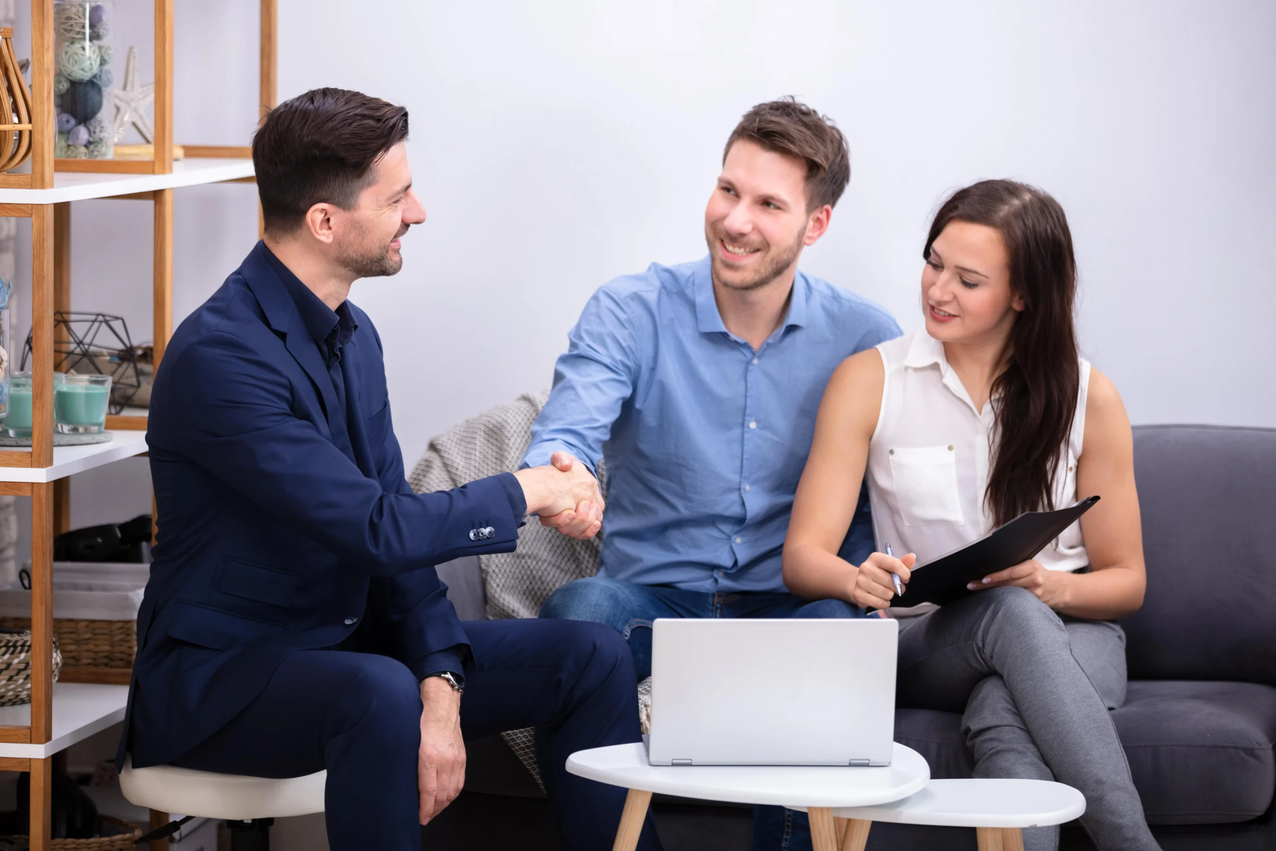 A group of people sitting around each other.